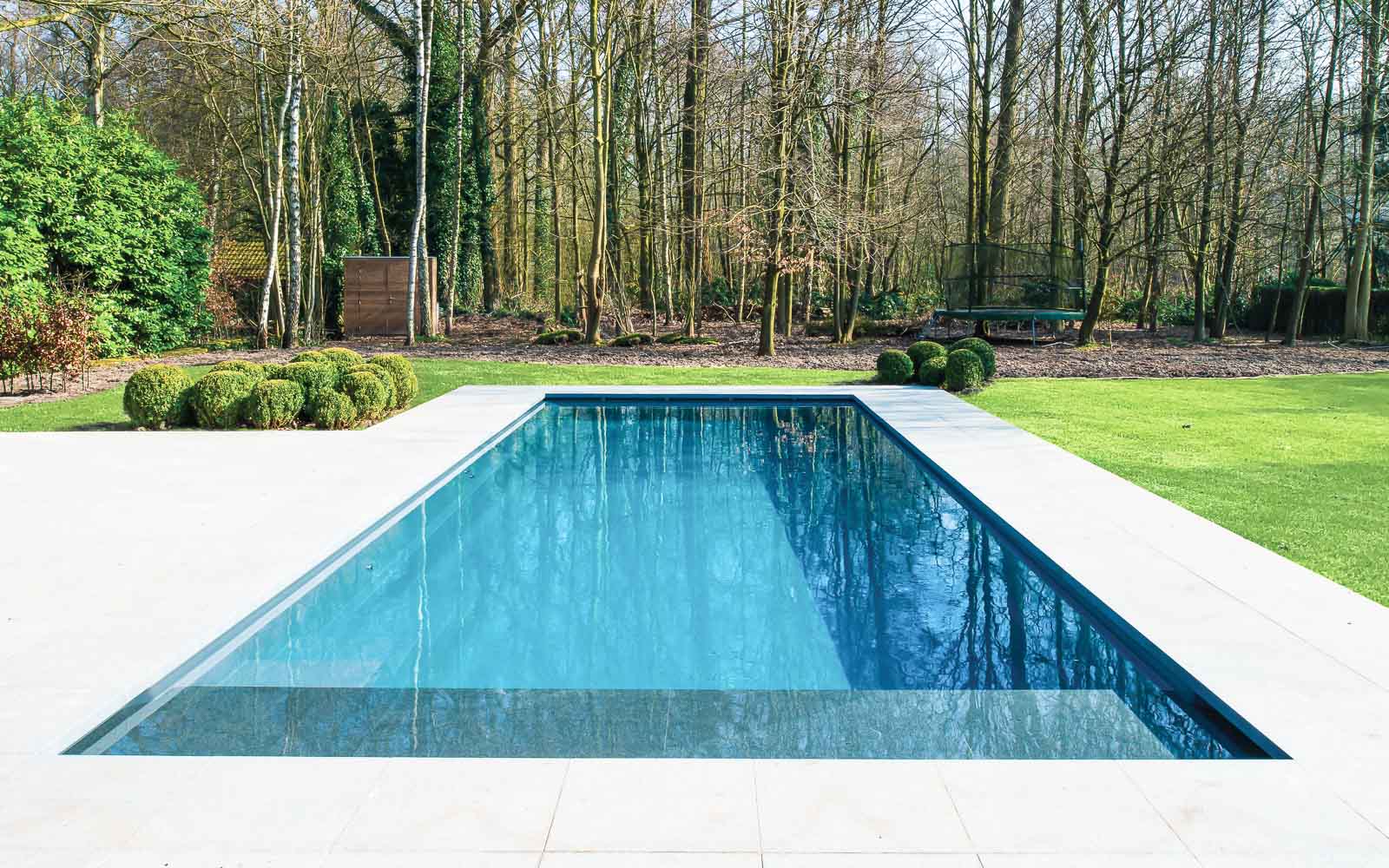 Leisure Pools Cube fiberglass swimming pool with automated cover box