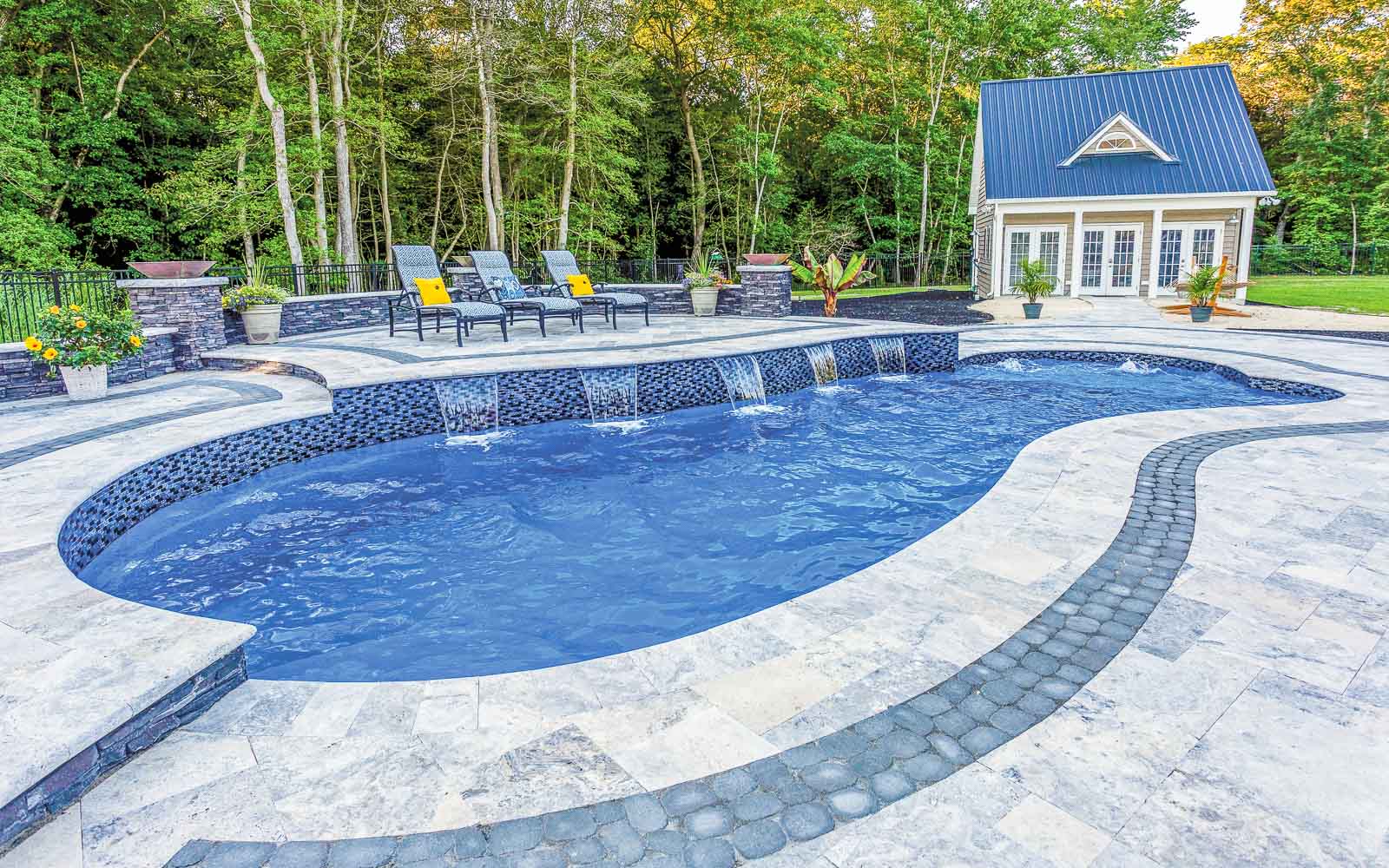 Leisure Pools Eclipse freeform fiberglass swimming pool with built-in splash deck