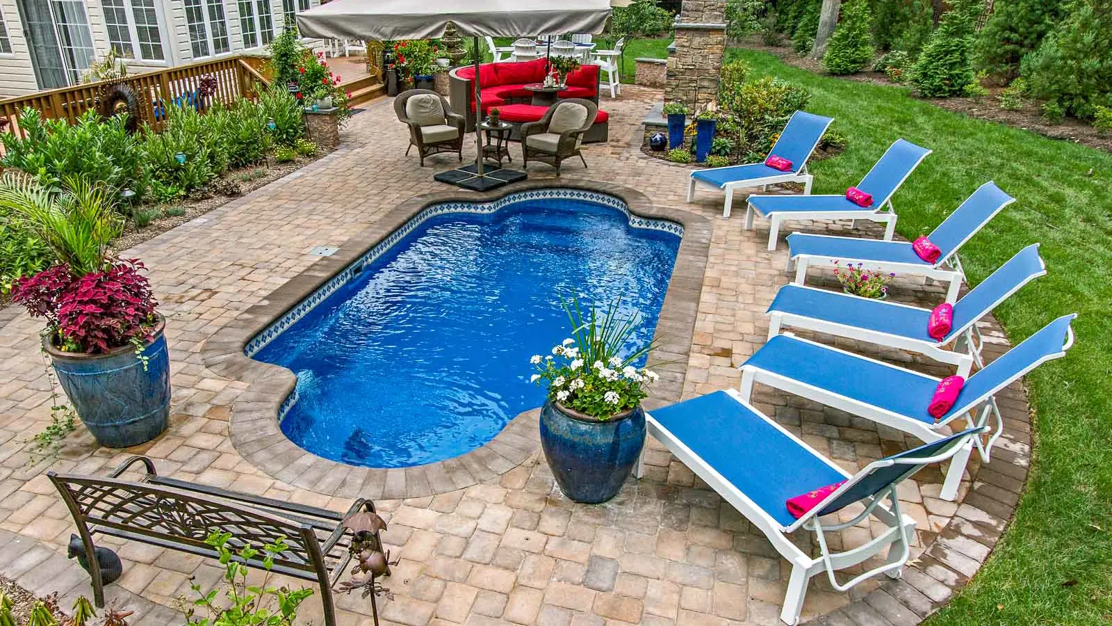 The Roman, a fiberglass pool that offers facing seats at both ends