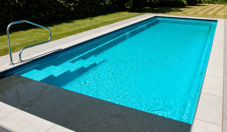 The Cube fiberglass pool submerged top bench and high water line edge detail in Silver Grey
