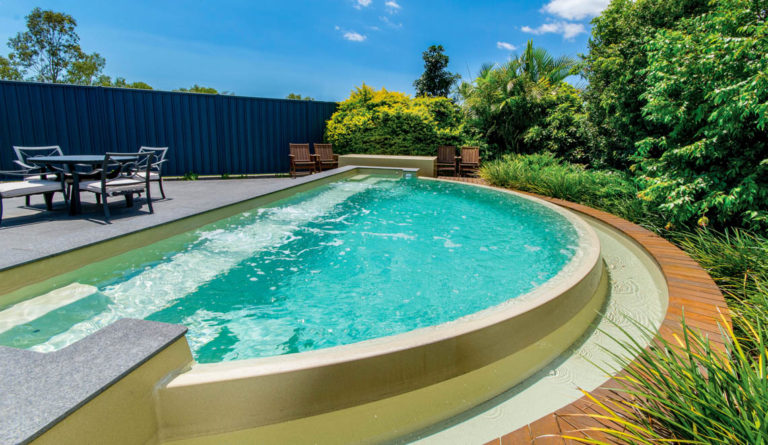 The Horizon fiberglass pool in Diamond Sand with vanishing edge and open swim corridor
