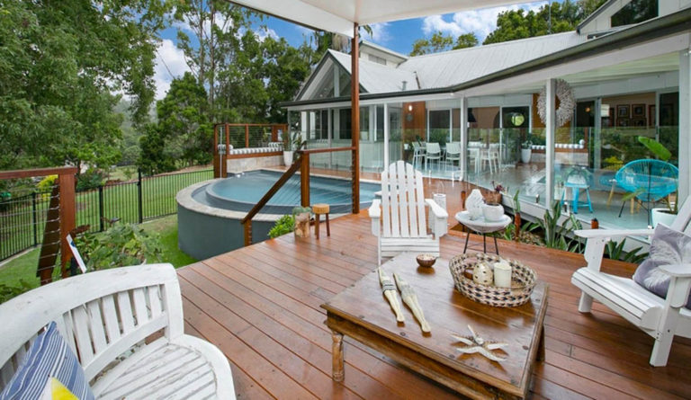 The Horizon inground fiberglass pool in Graphite Grey installed in backyard setting