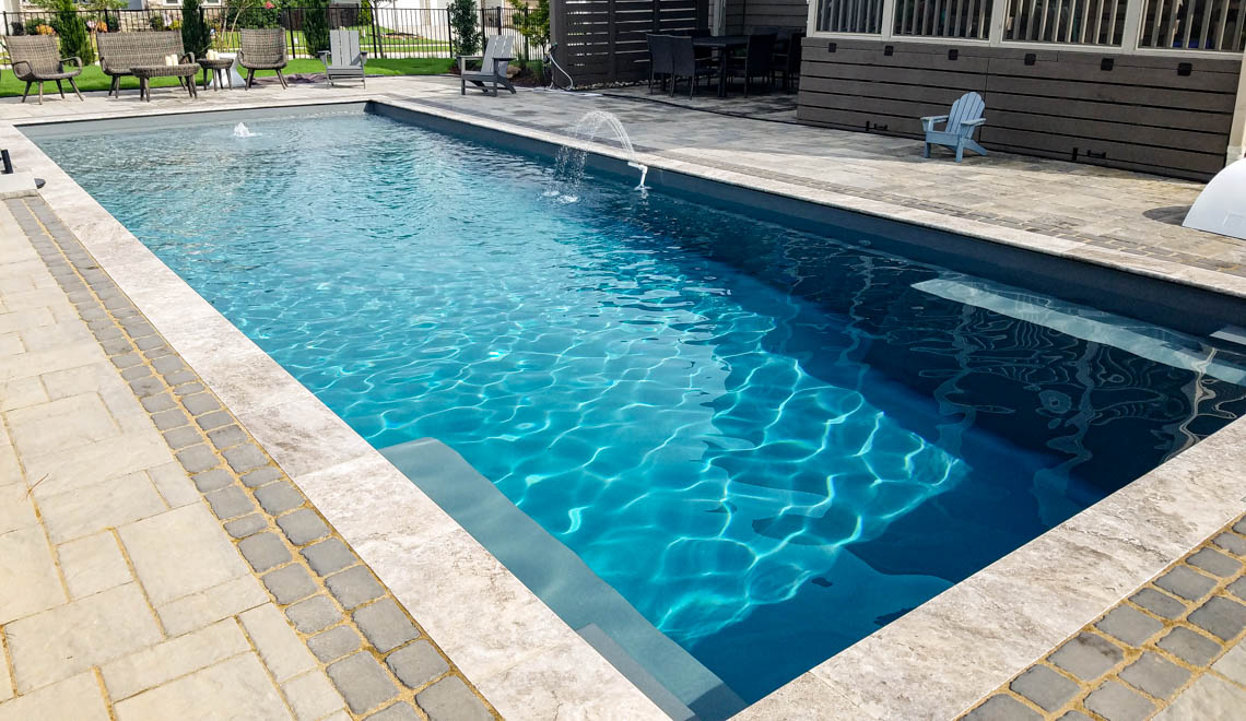 Leisure Pools Pinnacle large precast swimming pool with built-in splash deck