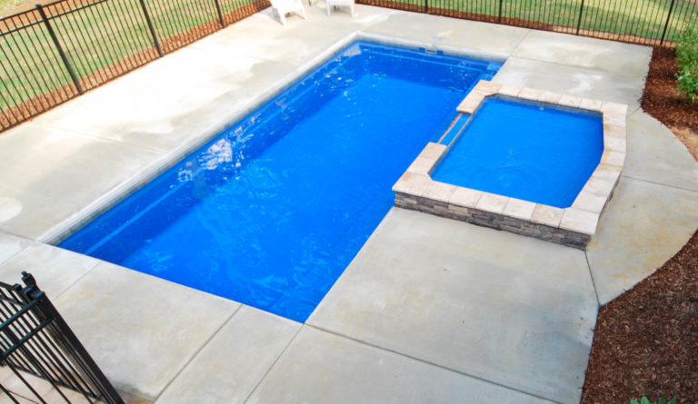 The Reflection fiberglass pool aerial view showing classic rectangular shape in Crystal Blue