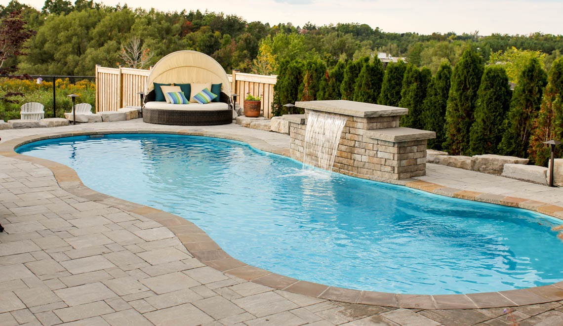 Leisure Pools Riviera composite fiberglass freeform swimming pool with perimeter swimout