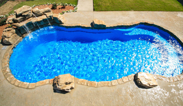 The Riviera fiberglass pool freeform curved edge and open swim area