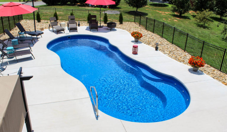 Leisure Pools Riviera freeform fiberglass pool aerial view with patio surround