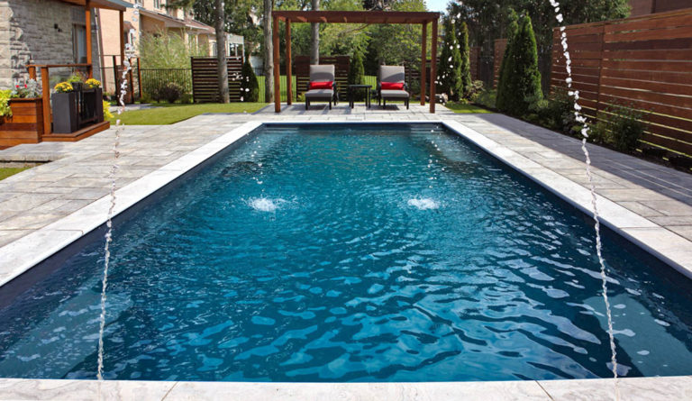 The Supreme 40 fiberglass pool overhead view with pergola and outdoor living space in Graphite Grey