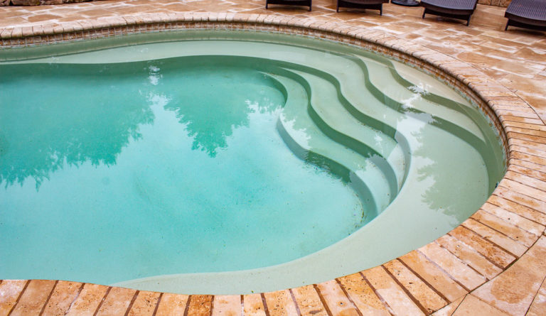 The Caribbean fiberglass pool wave-style entry steps detail in Diamond Sand