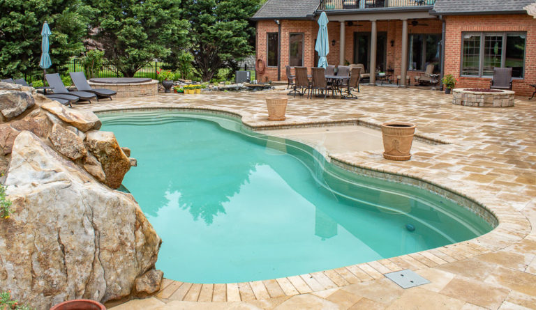 The Caribbean freeform fiberglass pool in Diamond Sand with unobstructed swim channel