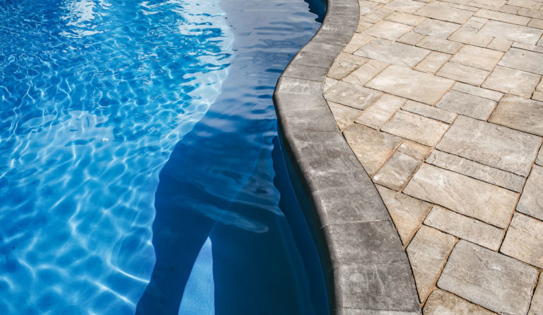 The Caribbean fiberglass pool curved wall and AquaGuard X gelcoat in Sapphire Blue