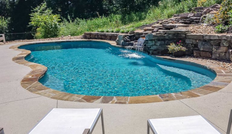 The Caribbean inground fiberglass pool in Silver Grey with rock water feature