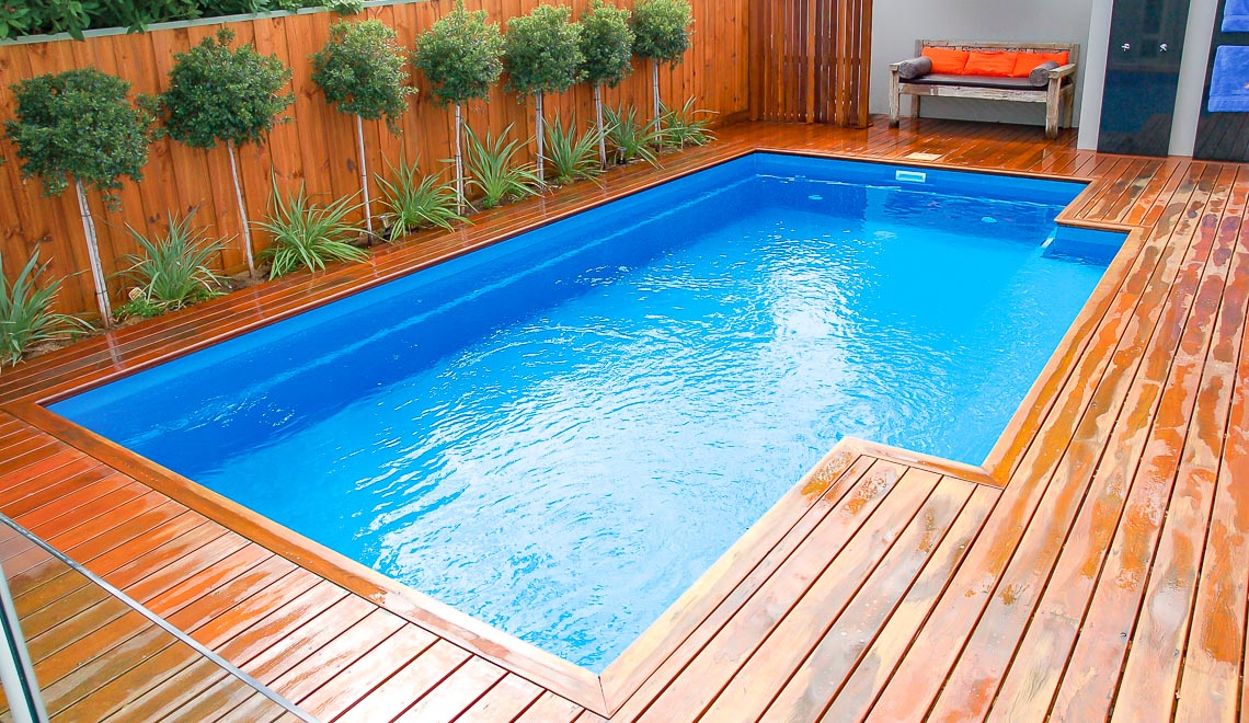 Leisure Pools Elegance fiberglass swimming pool with perimeter swimout