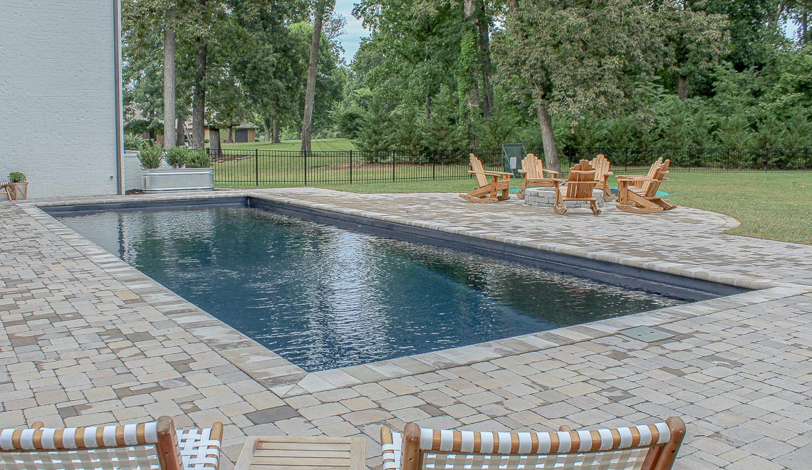 Leisure Pools Infinity large precast composite swimming pool with built-in steps and bench