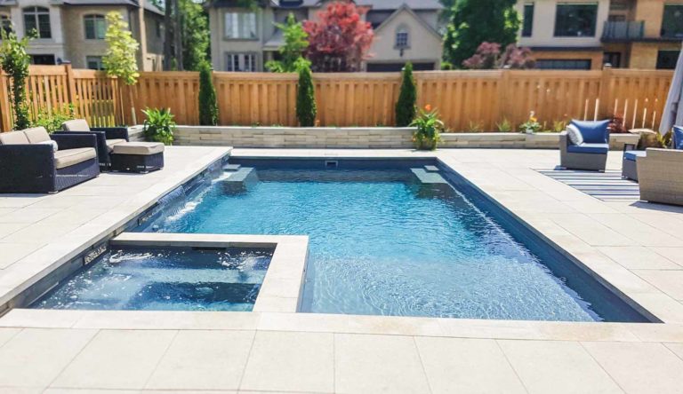 Leisure Pools Ultimate fiberglass swimming pool with built-in spa