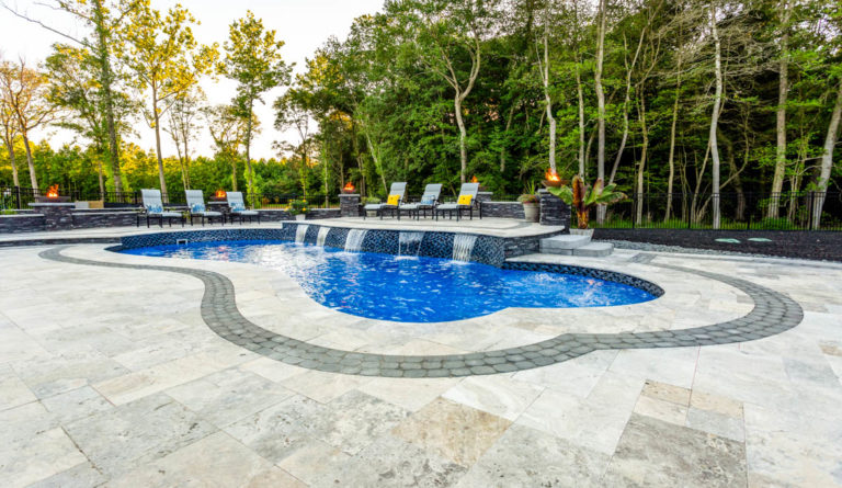The Eclipse 40-foot fiberglass pool with water feature and poolside outdoor living space