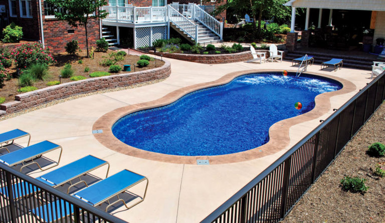 Leisure Pools Mediterranean fiberglass pool unobstructed swim channel and freeform design