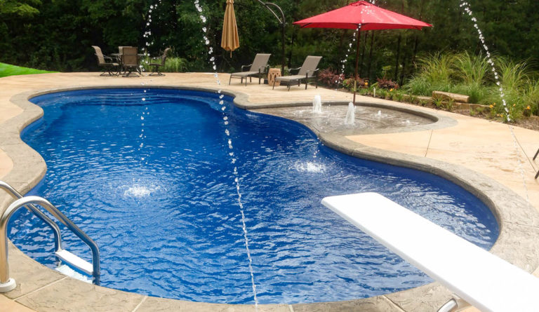 The Mediterranean fiberglass pool deep end showing 8-foot diving depth and spray fountain