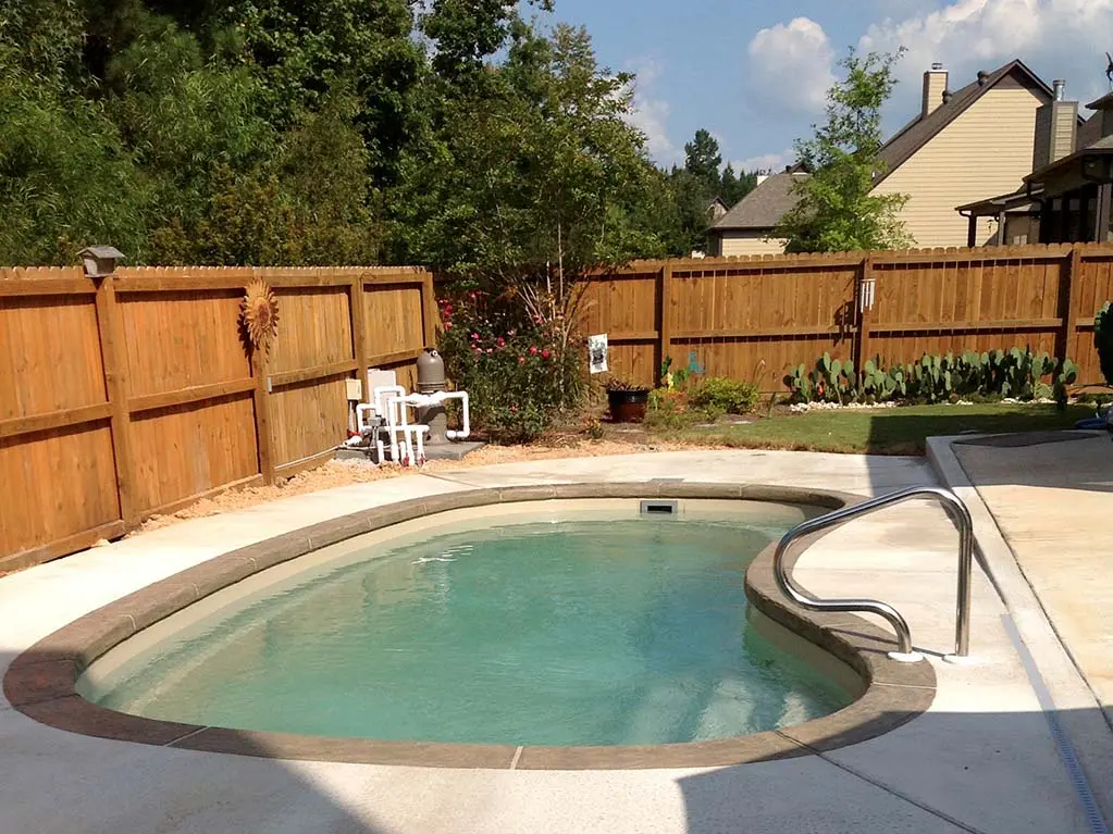 a recently installed inground fiberglass swimming pool