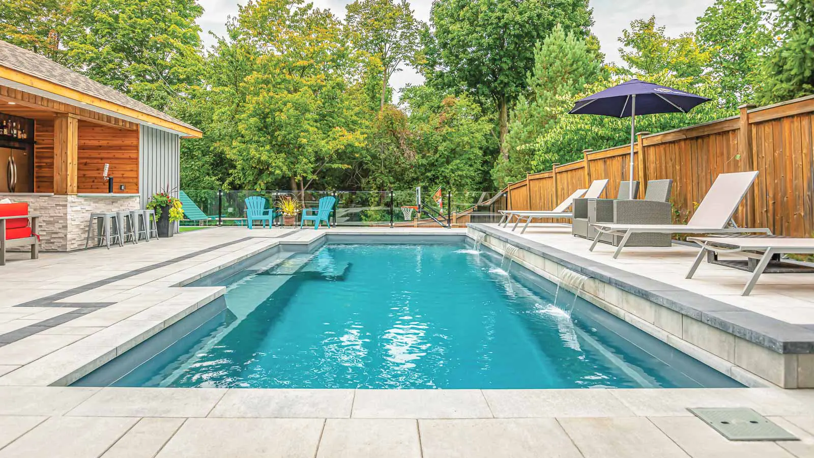 The Elegance, a fiberglass pool with a cut-out step design