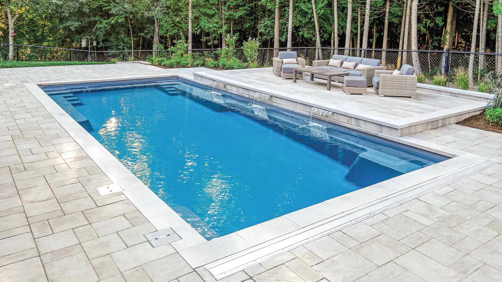 The Supreme, a fiberglass pool with a generous swim area and limited entry steps