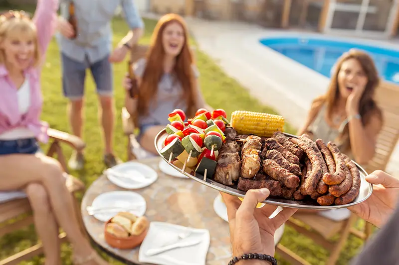 Great food for a party at a backyard fiberglass swimming pool