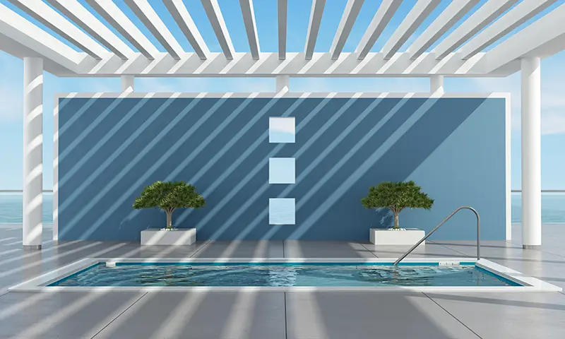 Leisure Pools Precision fiberglass swimming pool with a pergola
