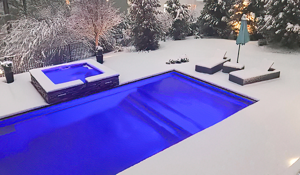 Leisure Pools fiberglass swimming pool in the snow.