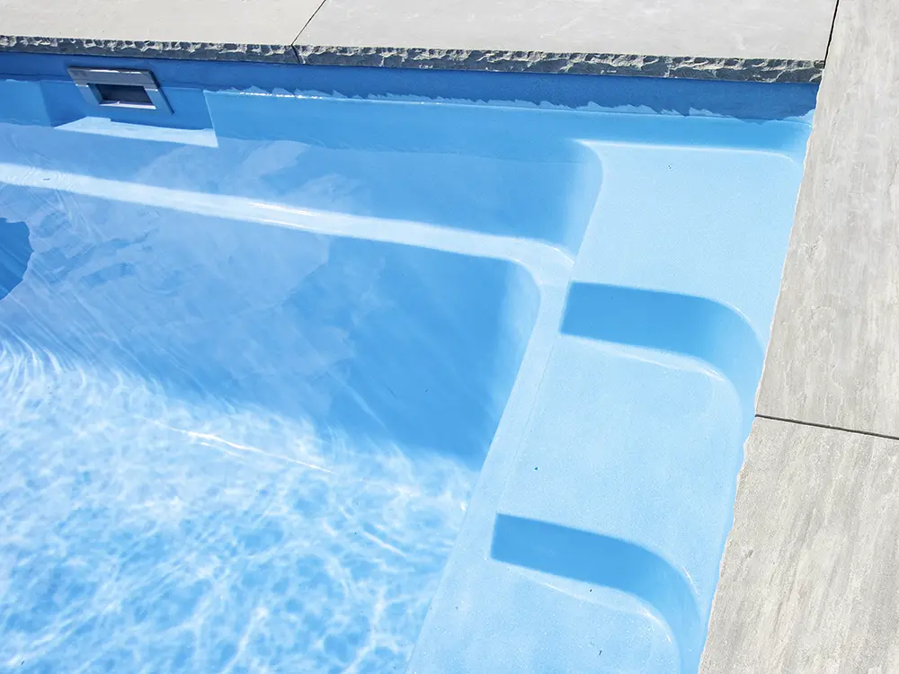 The installation and maintenance cost differences between concrete and fiberglass pools