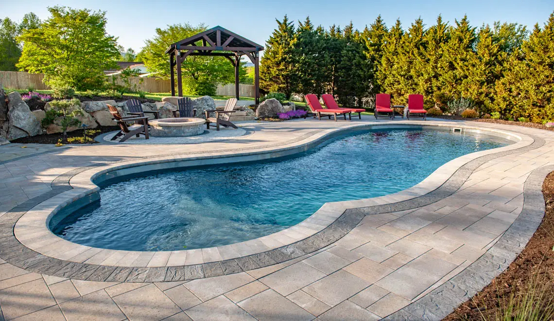 Leisure Pools Eclipse freeform inground fiberglass swimming pool in Graphite Grey