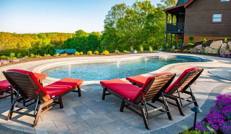 Leisure Pools Eclipse 40 fiberglass pool with mountain view and lounge seating