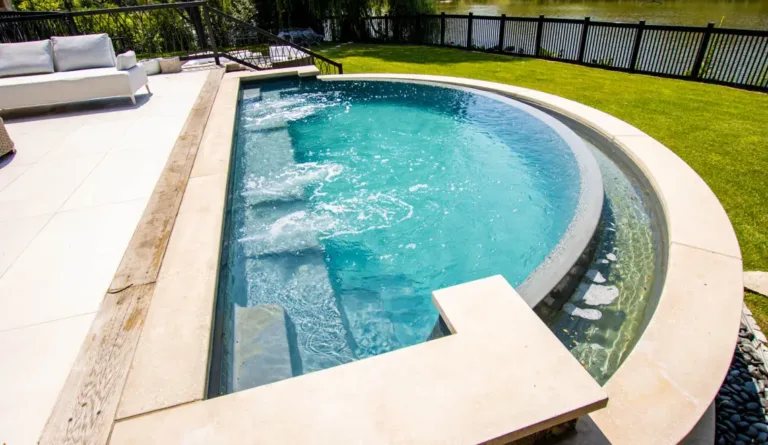 The Horizon fiberglass pool built-in catch basin and external steps in Graphite Grey