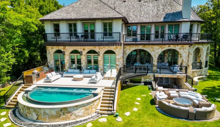 The Horizon fiberglass pool aerial view showing full crescent shape in Graphite Grey