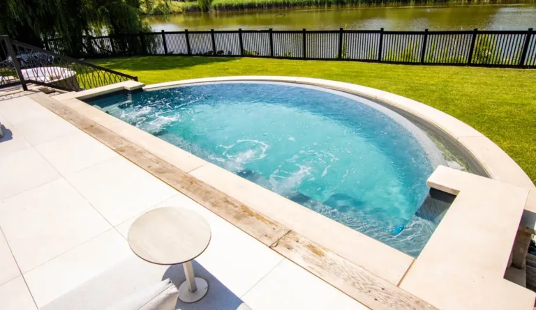 The Horizon fiberglass pool internal and external entry steps close-up in Graphite Grey
