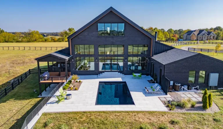 Leisure Pools Supreme 35 fiberglass pool in Graphite Grey with backyard outdoor living space