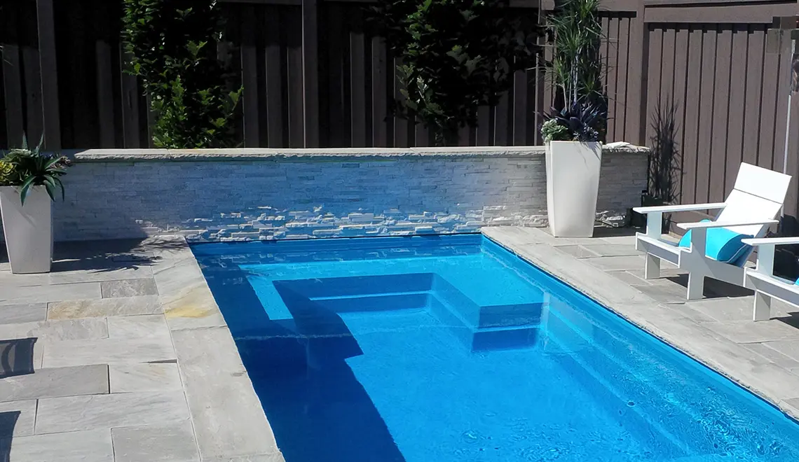 The Palladium Plunge fiberglass pool lounge seating and entry steps