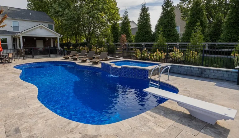 Leisure Pools 40' Caribbean in Sapphire Blue with tanning ledge enhancement.