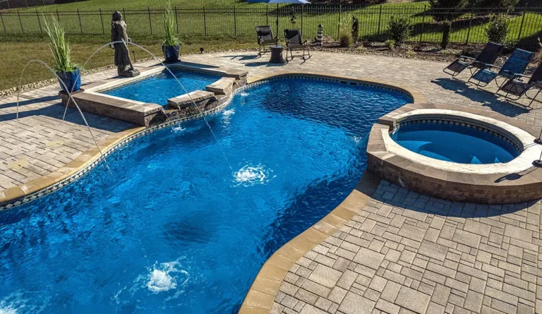 Leisure Pools 40' Mediterranean with spa and tanning ledge enhancements.