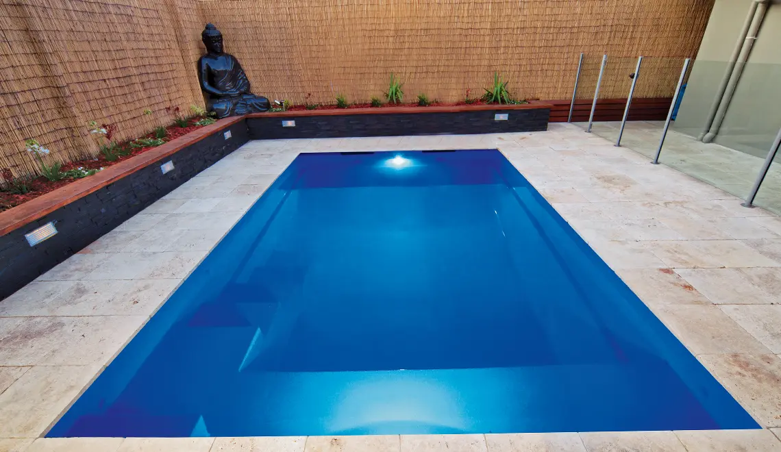Leisure Pools Precision fiberglass flat bottom swimming pool with built-in splash deck