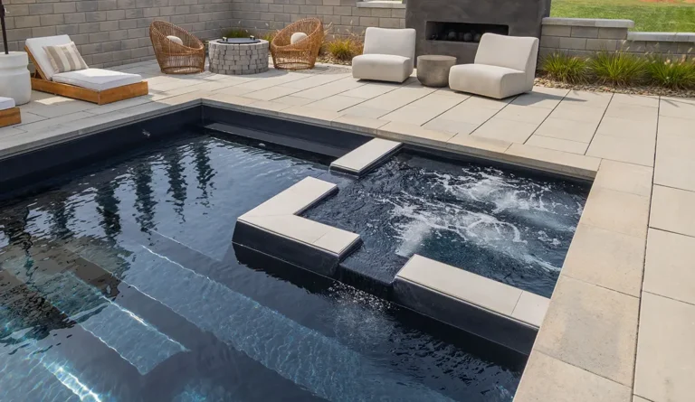 The Icon fiberglass pool built-in spa and entry steps detail in Ebony Blue
