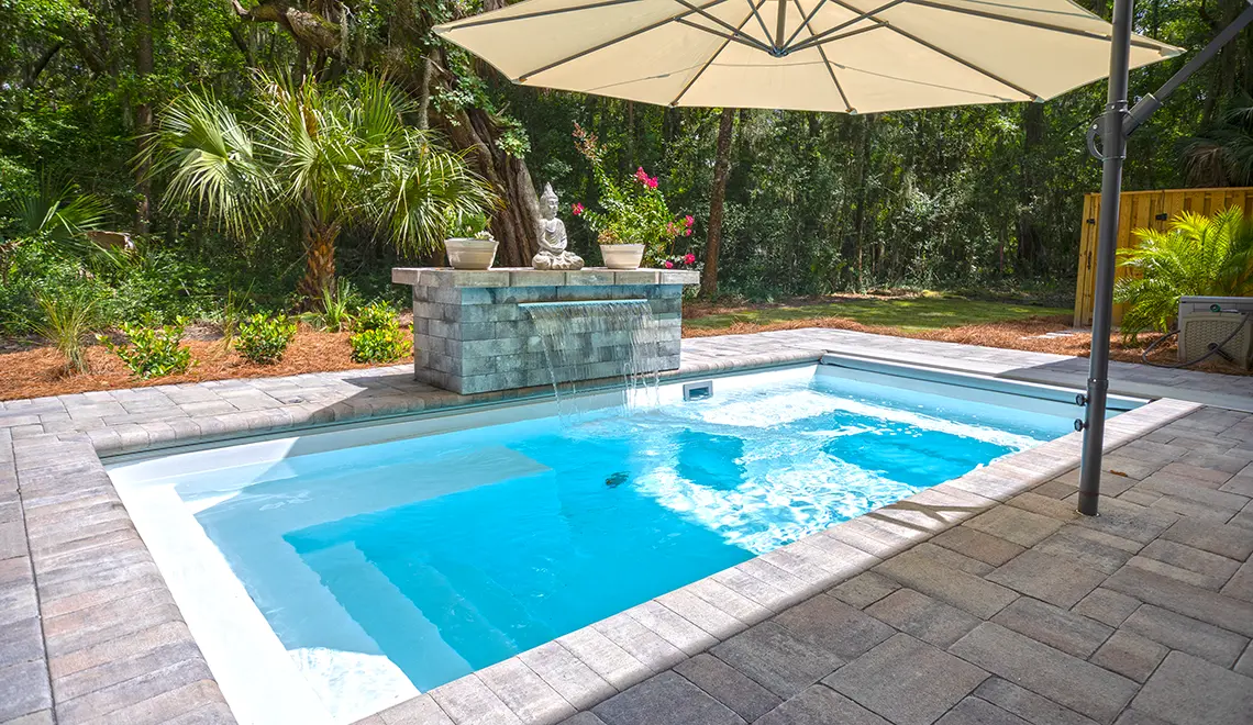 Leisure Pools Palladium Plunge fiberglass pool ample lounge seating ledge detail