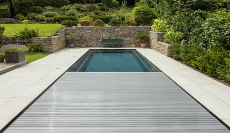 The Linear rectangular fiberglass pool with automatic cover deployed