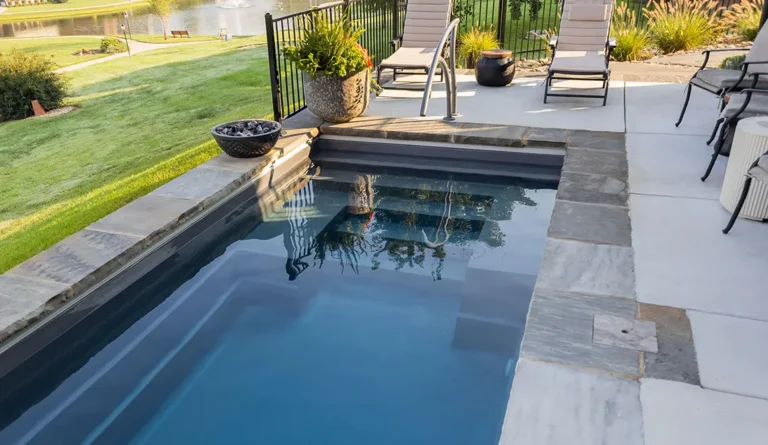 The Palladium Plunge fiberglass pool lounge seating and entry steps