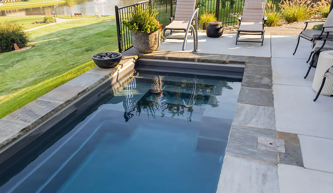 The Palladium Plunge fiberglass pool lounge seating and entry steps