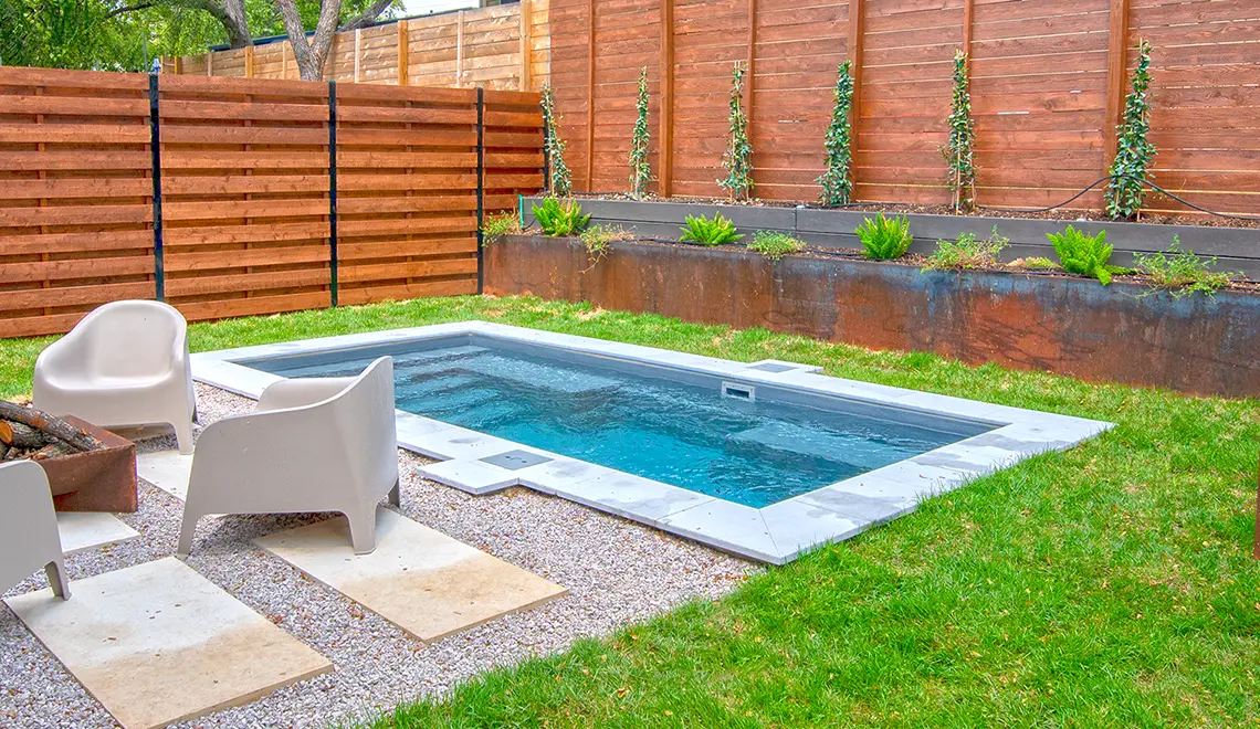 Leisure Pools Palladium Plunge fiberglass pool ample lounge seating ledge detail