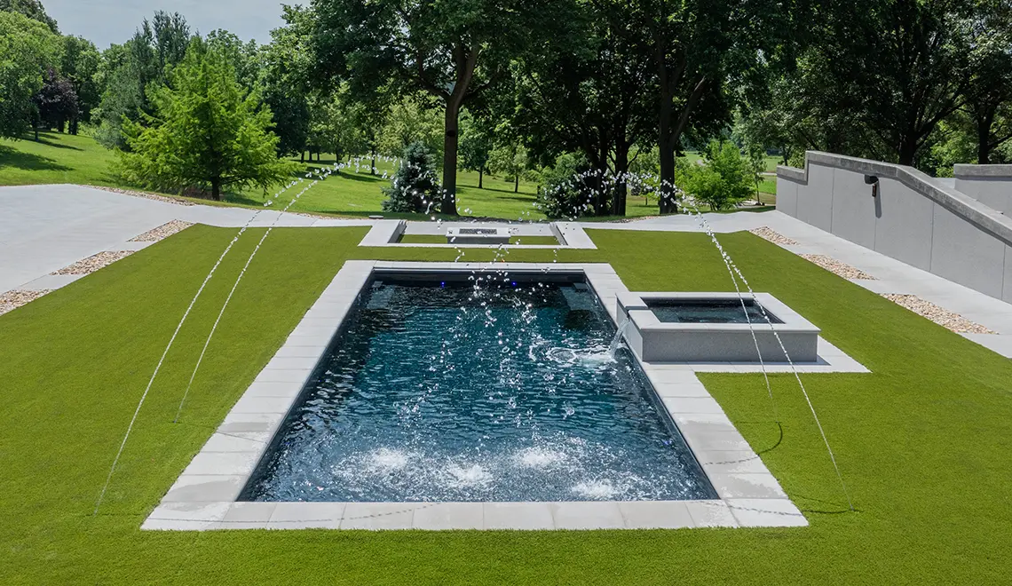 Leisure Pools Pinnacle large precast swimming pool with built-in splash deck