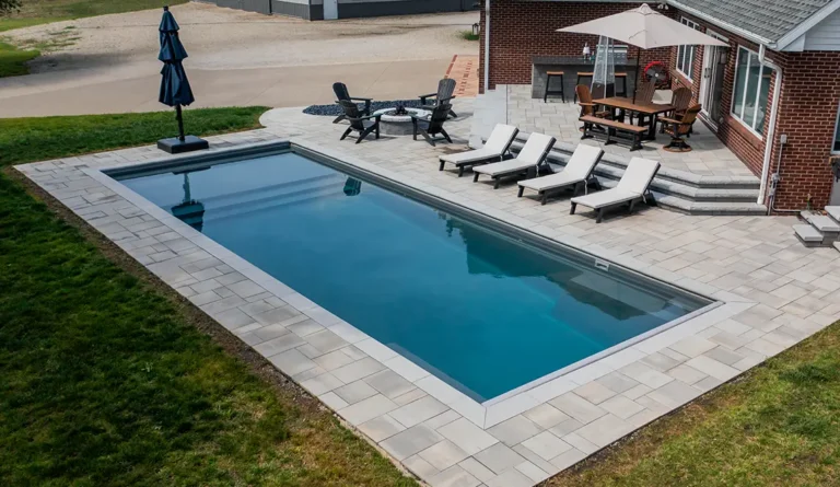 Leisure Pools Pinnacle large precast swimming pool with built-in splash deck