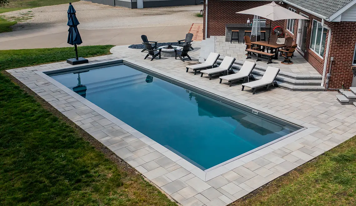 Leisure Pools Pinnacle large precast swimming pool with built-in splash deck