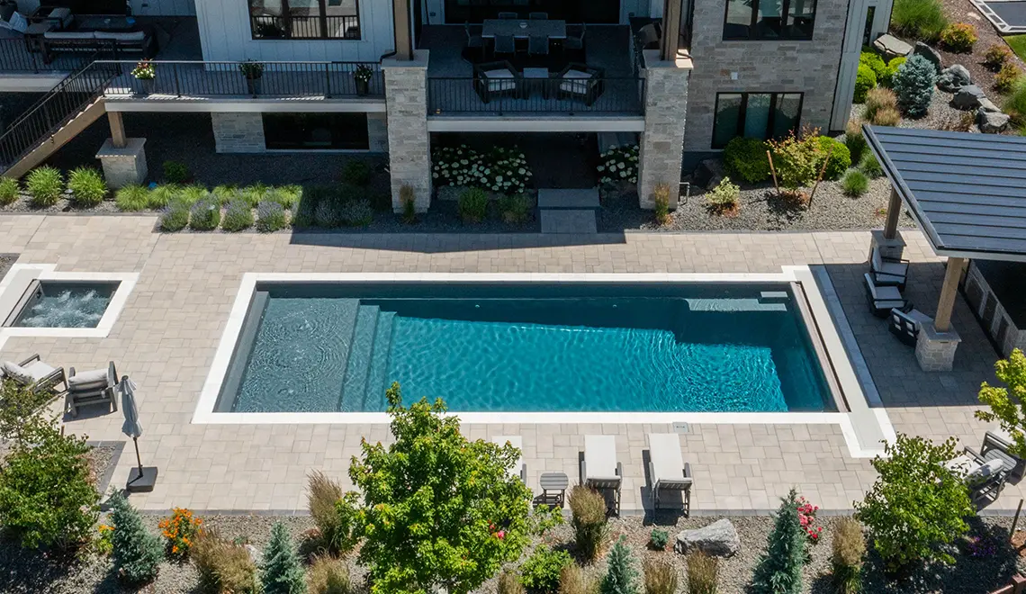 Leisure Pools Pinnacle large precast swimming pool with built-in splash deck