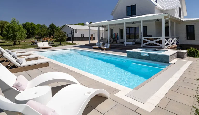 Leisure Pools Pinnacle large precast swimming pool with built-in splash deck
